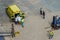 Ambulance personnel and cruise ship crew on a dock in Aruba taking a  passenger off the ship