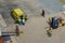 Ambulance personnel and cruise ship crew on a dock in Aruba taking a  passenger off the ship