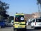 Ambulance on road responding for an emergency call of road accidents, Translation of Arabic text (