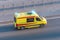 Ambulance van fast ride on highway, aerial top view