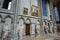 The ambulatory of the interior of the Rouen Cathedral in Rouen France with stained glass windows, statues and renaissance painting