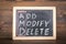 AMD. ADD, MODIFY and DELETE. Business concept. Chalk board with an inscription