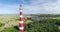 Ameland Lighthouse Close Up with Vacation Park, Rising Shot - Ameland, The Netherlands, 4K Drone Footage