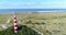 Ameland Lighthouse, North Sea and Dunes, Reveal Shot - Ameland, The Netherlands, 4K Drone Footage