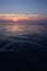 Ameland,Netherlands April 2021:Beach sunset, sunrise reflecting on wet sand. Cold blue and orange golden sunset over