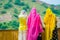 Amer, India - September 19, 2017: Unidentified women posing in a stoned wall, wearing a yellow and pink clothes, and