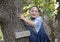 Amerasian girl posing in the trees in Oklahoma City, Oklahoma