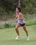 Amerasian teenageboy racing up a hill in a 5 kilometer race in Stillwater, Oklahoma.