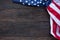 America flag waving pattern on wooden background in table top view, red blue white strip concept for USA 4th july independence day