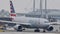 American Airlines doing taxi in Munich Airport, snow