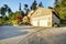 American architecture. House with clapboard siding and stone trim.