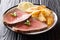 American beef steak with a fried potato slices close-up on a plate. horizontal