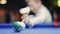 American billiard. Boy playing billiard, snooker. Kid hits the ball