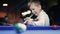 American billiard. Boy playing billiard, snooker. Kid preparing to hit the ball