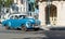 American blue Chevrolet classic car with white roof drived on the main street in Havana City Cuba - Serie Cuba Reportage