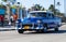 American blue classic car as taxi in havana city on the malecon