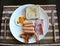 American breakfast has ham egg sausage beacon on tablemat
