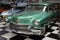 American car, the Cadillac Series 62 in green