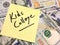 American cash money and yellow post it note with text Kids College