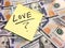 American cash money and yellow post it note with text Love with question mark