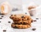 American chocolate chip cookies with chocolate on light marble background. Delicious dessert, close up