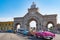 American classic cars on Main Gate of Colon Cemetery, Havana, Cuba. American classic cars in front of Gate of Peace 