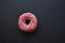 American delicious donuts on a black background