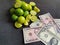 American dollar money and lemon fruits on the black background