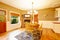 American farm house breakfast dining room area with brick fireplace.