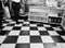 American Fifties Diner - Waitress Walking on Black and White Checkerboard Floor