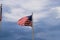 American flag against blue sky with clouds at the Savannah riverfront