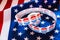 American flag background in election campaign with stickers of I vote for supporters