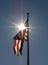American Flag blue sky sunlight sparkle prism