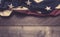 An American flag or bunting on a wooden background