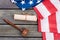 American flag, Constitution and wooden gavel.