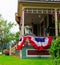 American flag decor on victorian porch