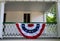 American flag  decoration on historic colonial home front porch