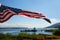 American Flag Flying Over Lake