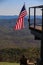 The American flag flying in the wind at Mt. Pisgah Inn in North Caroline overlooking the Blue Ridge Mountains.