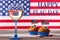 American flag, glass of white wine and cute cupcakes