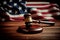 American flag, a golden scale and a judges gavel symbolizing the American justice system or the Judicial Branch of