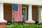American flag hanging on front porch