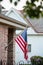 American Flag Hanging from a House