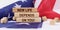 The American flag has wooden cubes and plaques that say - NEW LIFE DEPENDS ON YOU