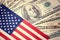 American flag on hundred dollar bill background. Vintage, retro look. Money, cash background. Financial concept.