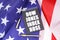 On the American flag lies a pen and a notebook with the inscription - Dow Jones index rose