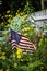 American flag outdoors in garden of wildflowers