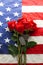 American flag with roses and blank dog tags