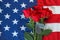 American flag with roses and military dog tags