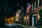 American flag and row houses on Bethel Street at night, in Fells Point, Baltimore, Maryland